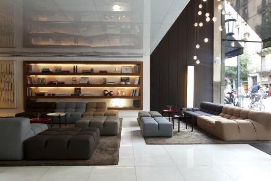 Modern interior design and boutique seating area in the Alexandra Barcelona Hotel lobby