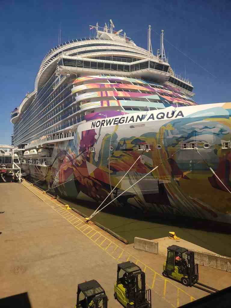 Norwegian Aqua Bermuda cruise review - Close-up view of the vibrant, colorful hull art on the bow of the Norwegian Aqua cruise ship docked at the Manhattan Cruise Terminal.