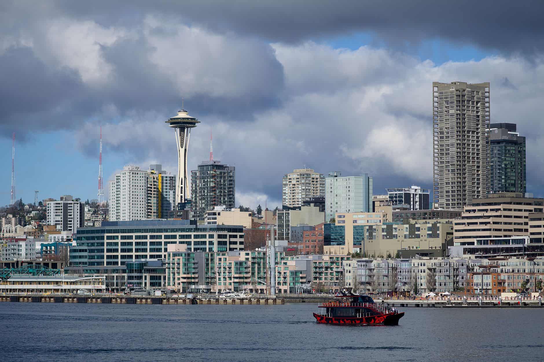 seattle skyline with space needle and ferry boat
