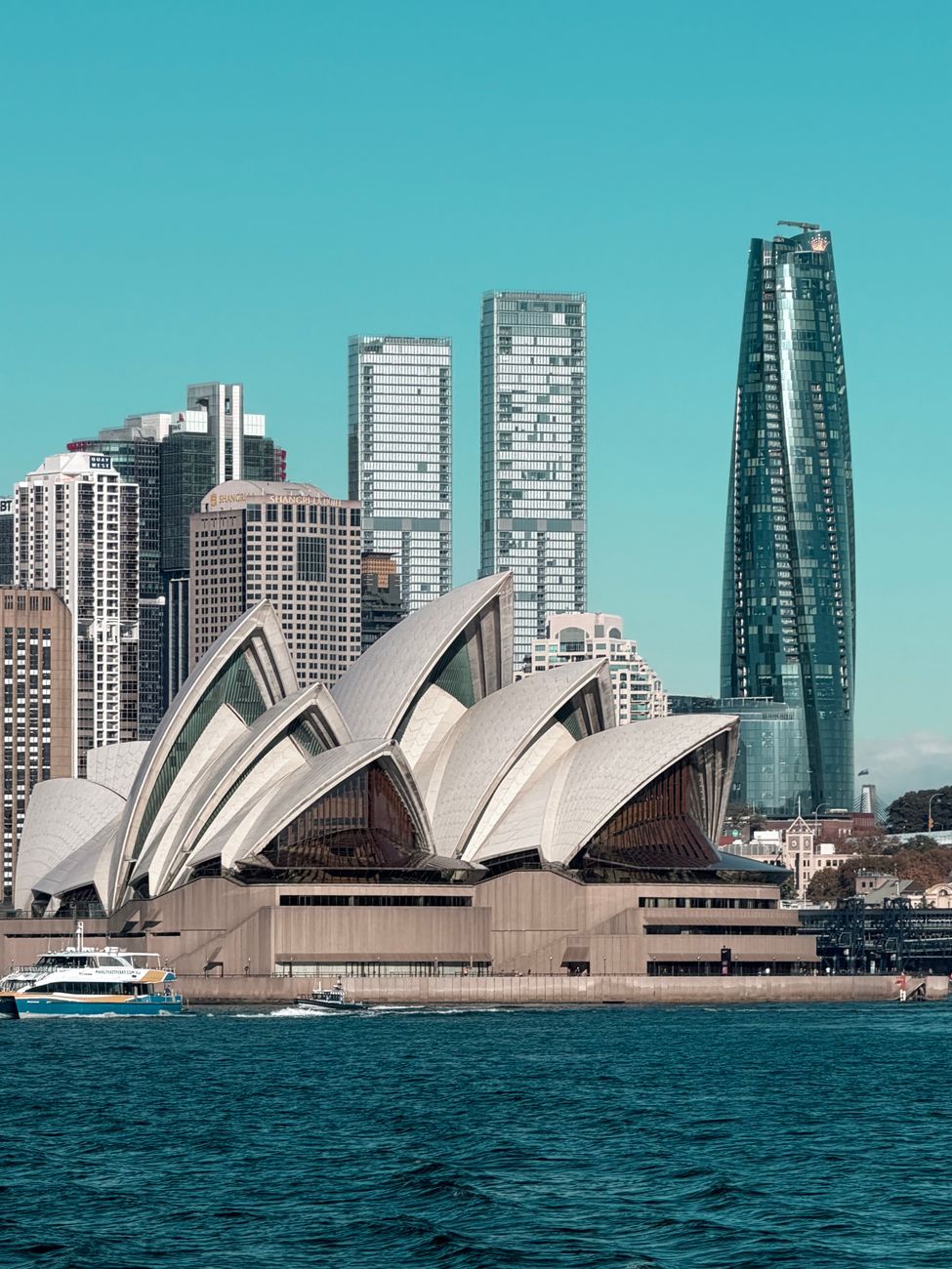 sydney opera house and city skyline in summer